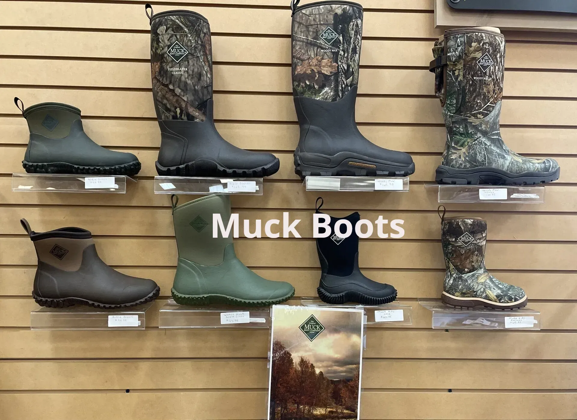 A display of muck boots in a store