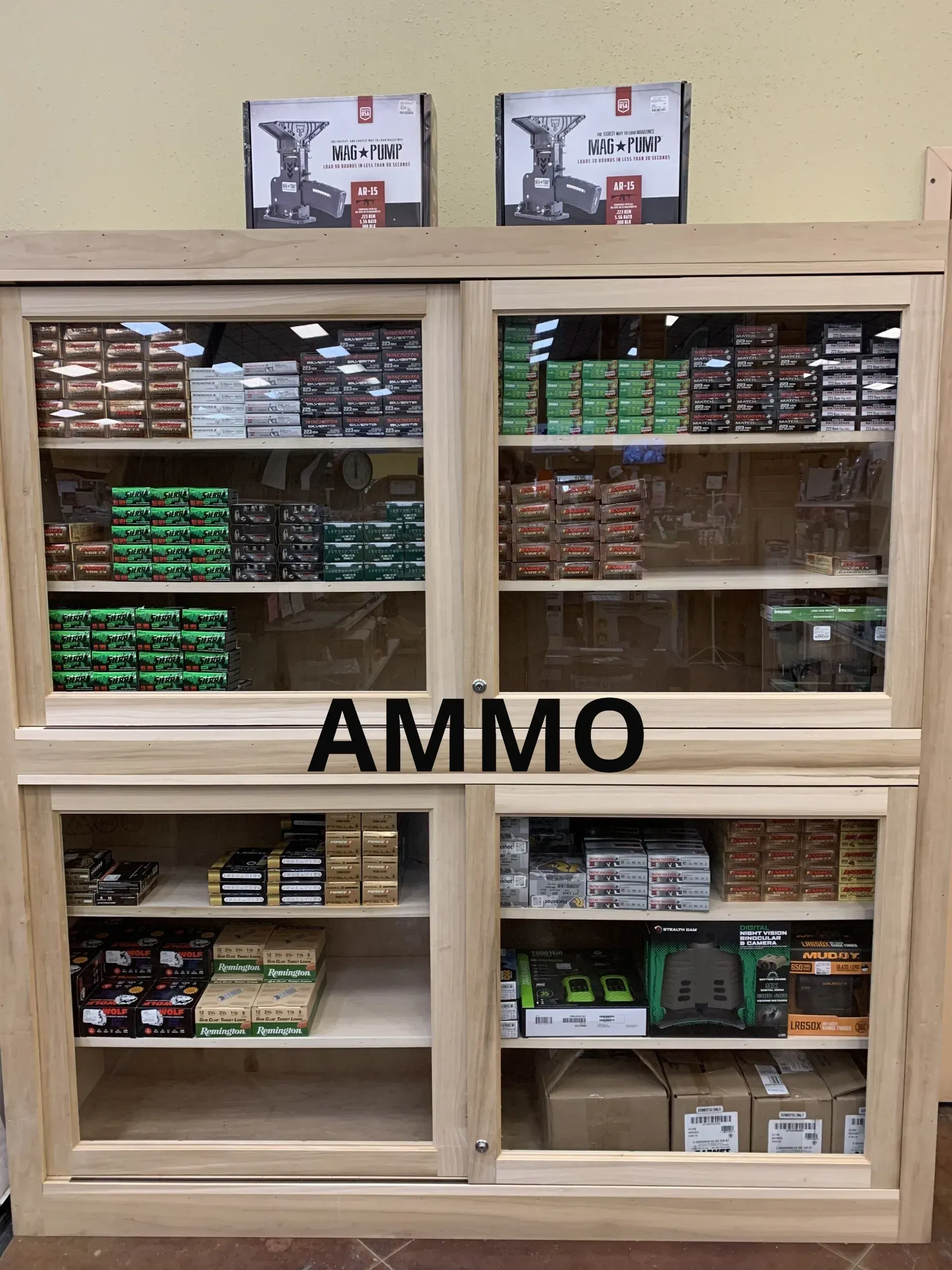 A wooden cabinet with the word ammo on it