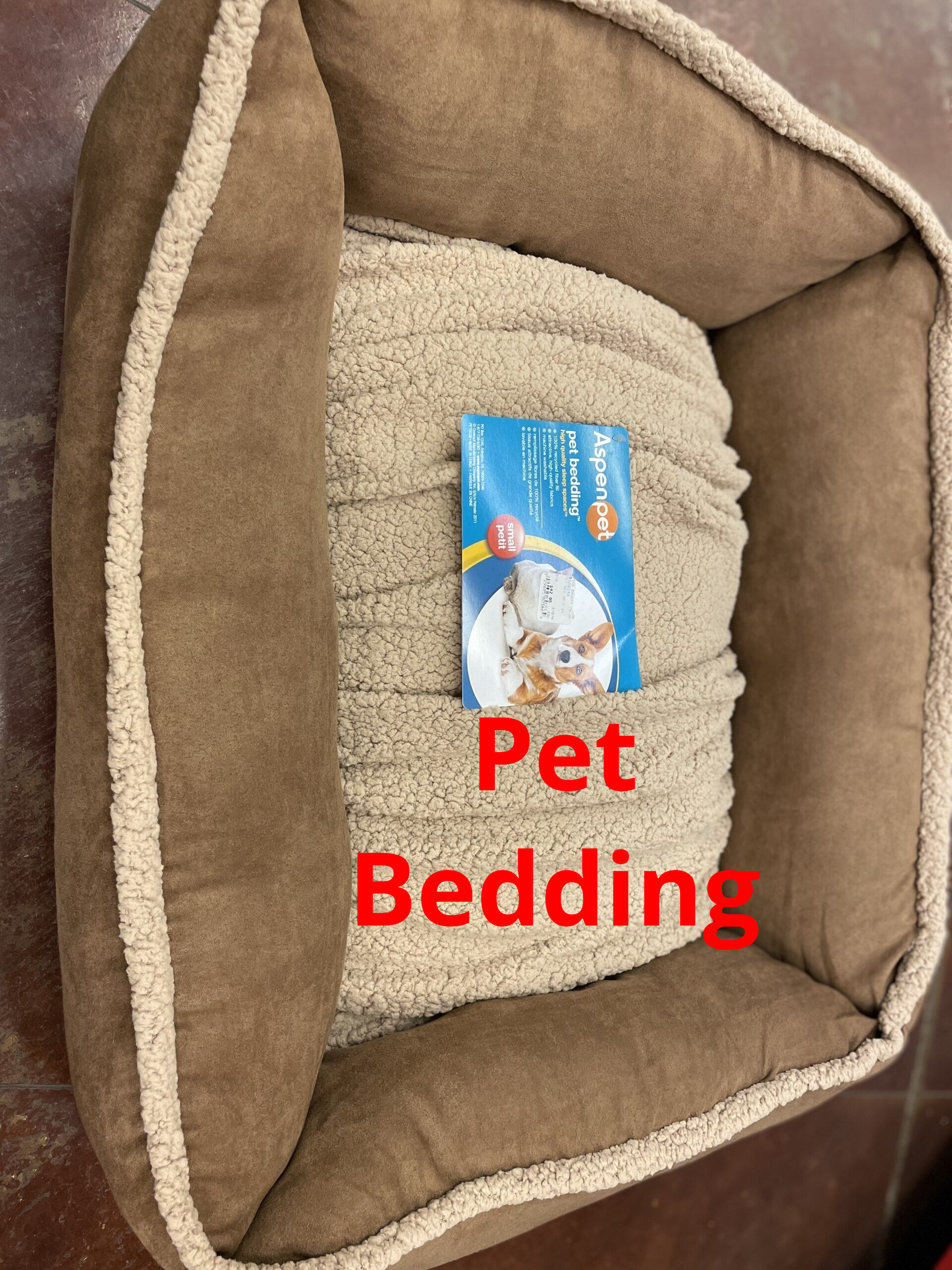 A pet bed with a picture of a cat on it