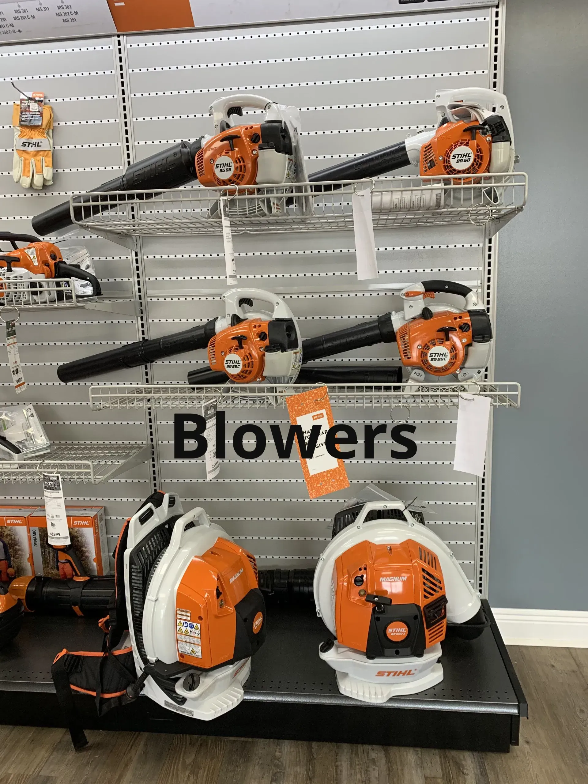 A display of blowers on a shelf in a store.