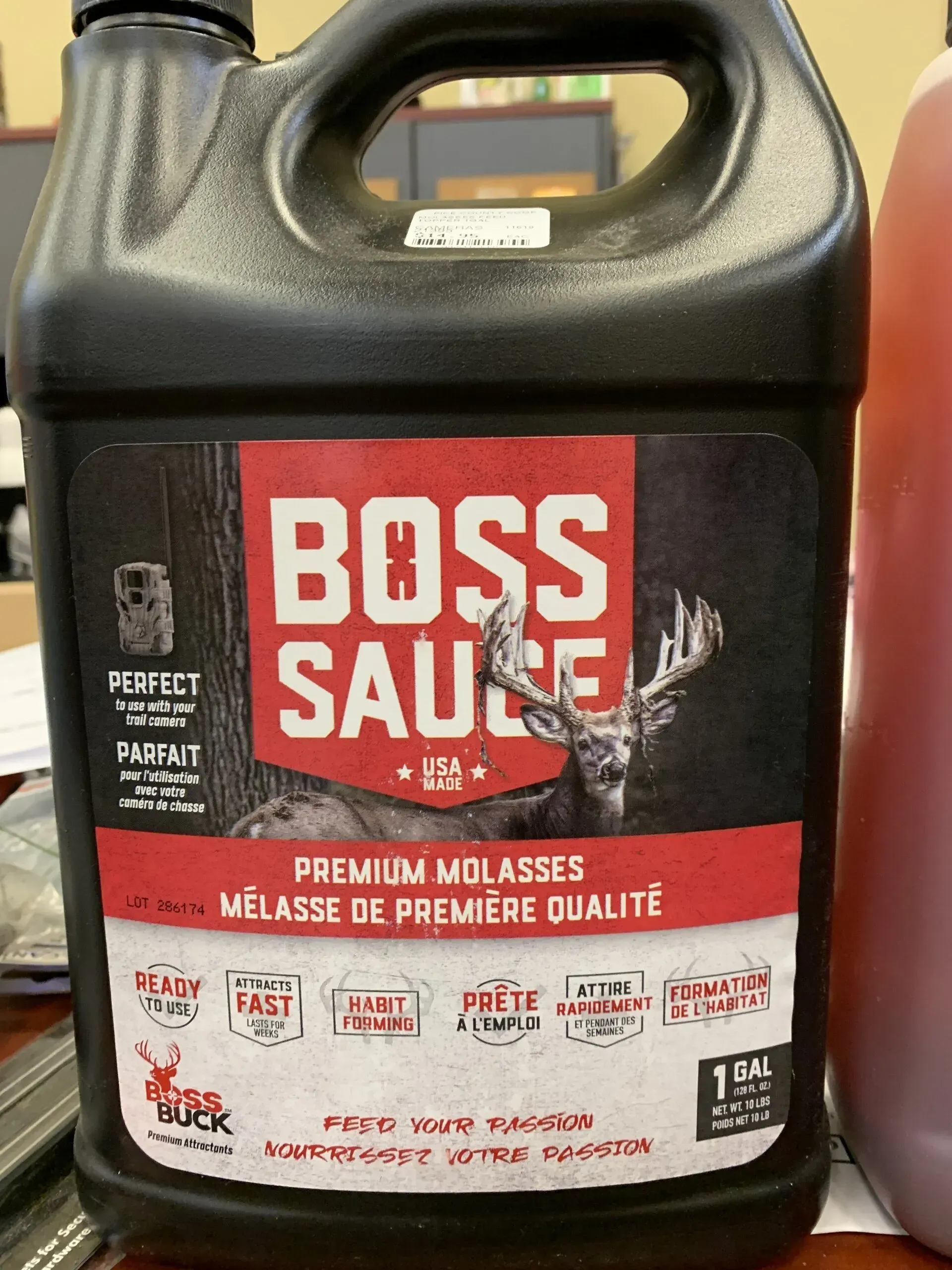 A gallon of boss sauce with a deer on the label