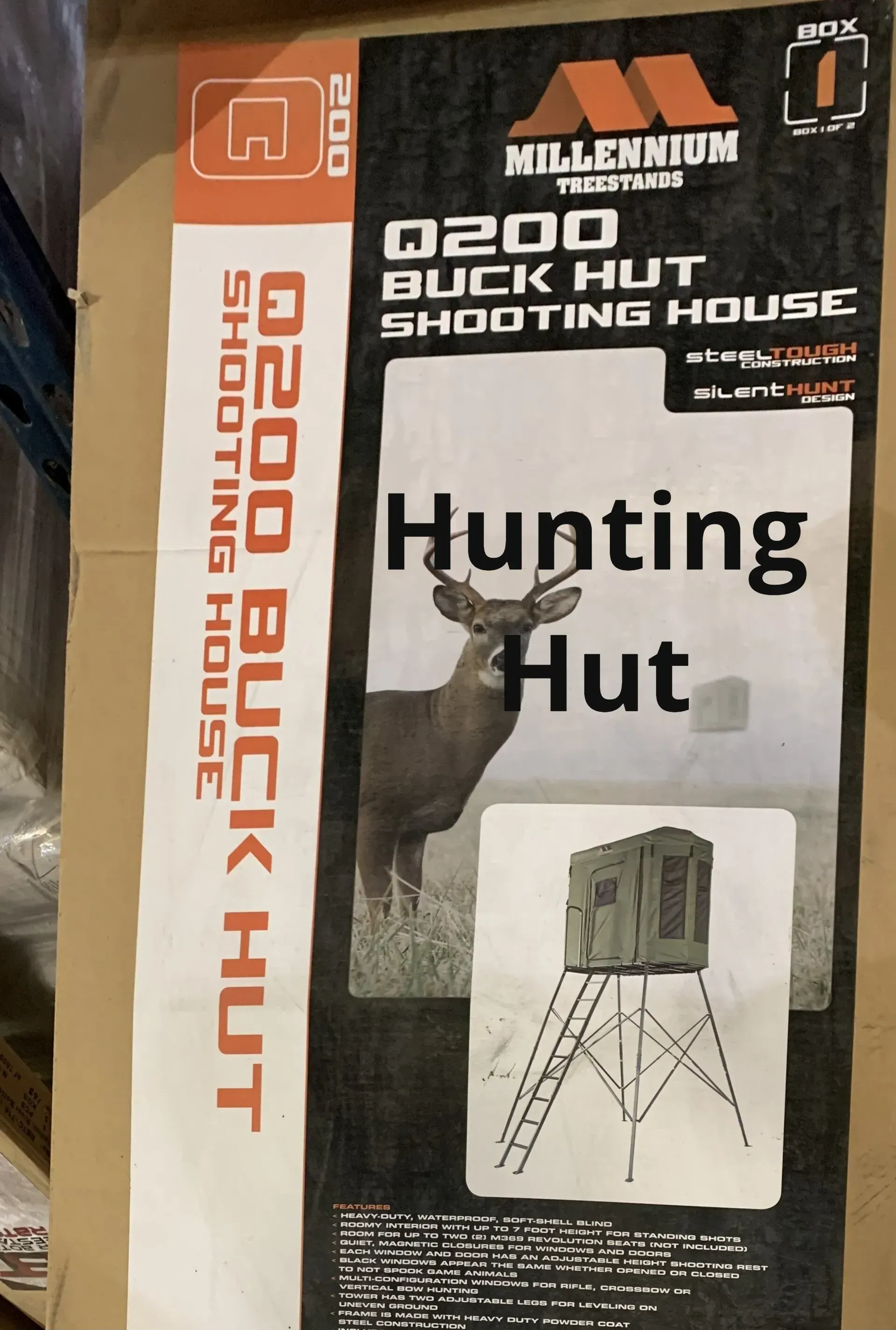 A box of a hunting hut with a picture of a deer on it