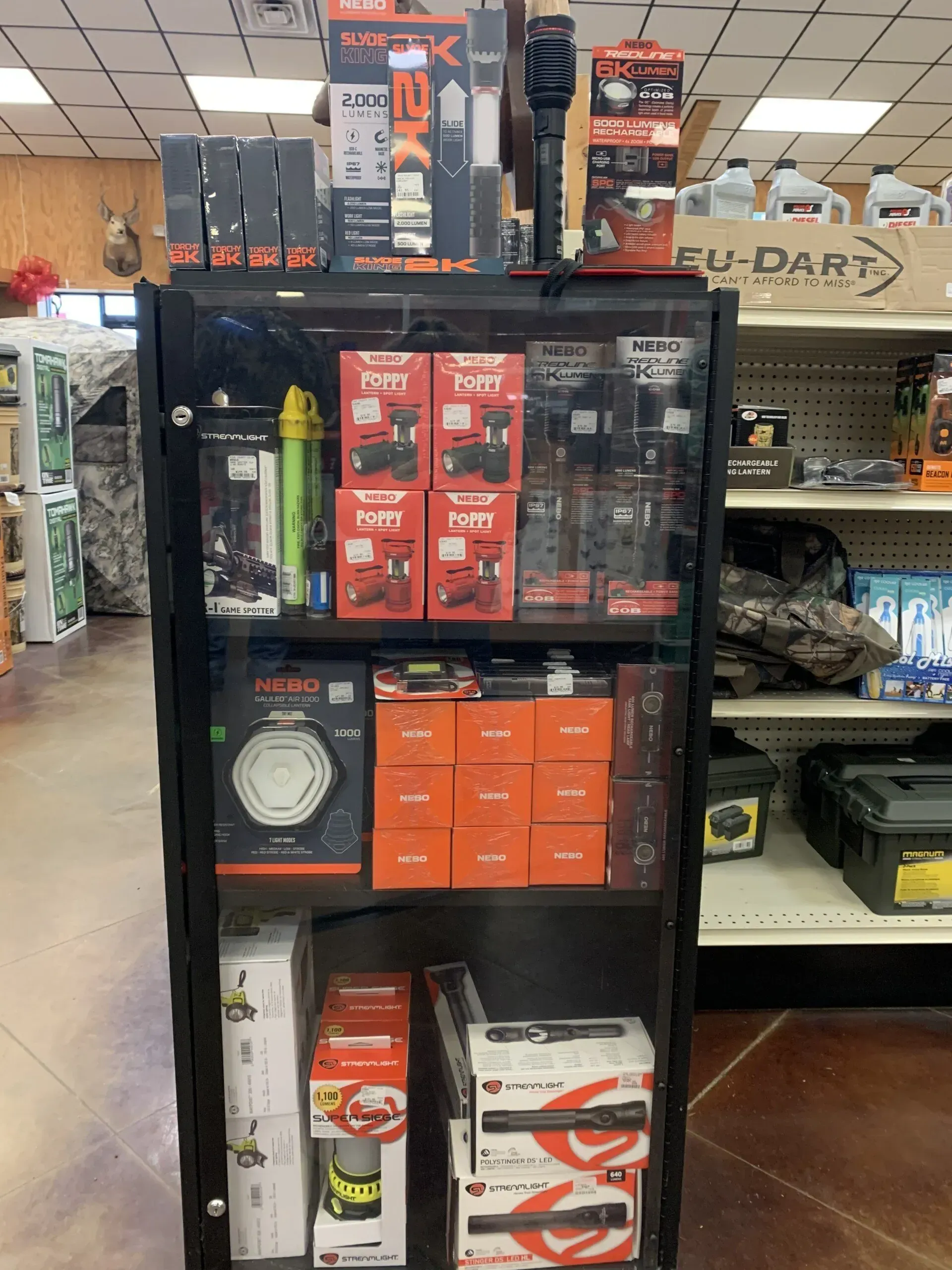 A shelf in a store filled with lots of products