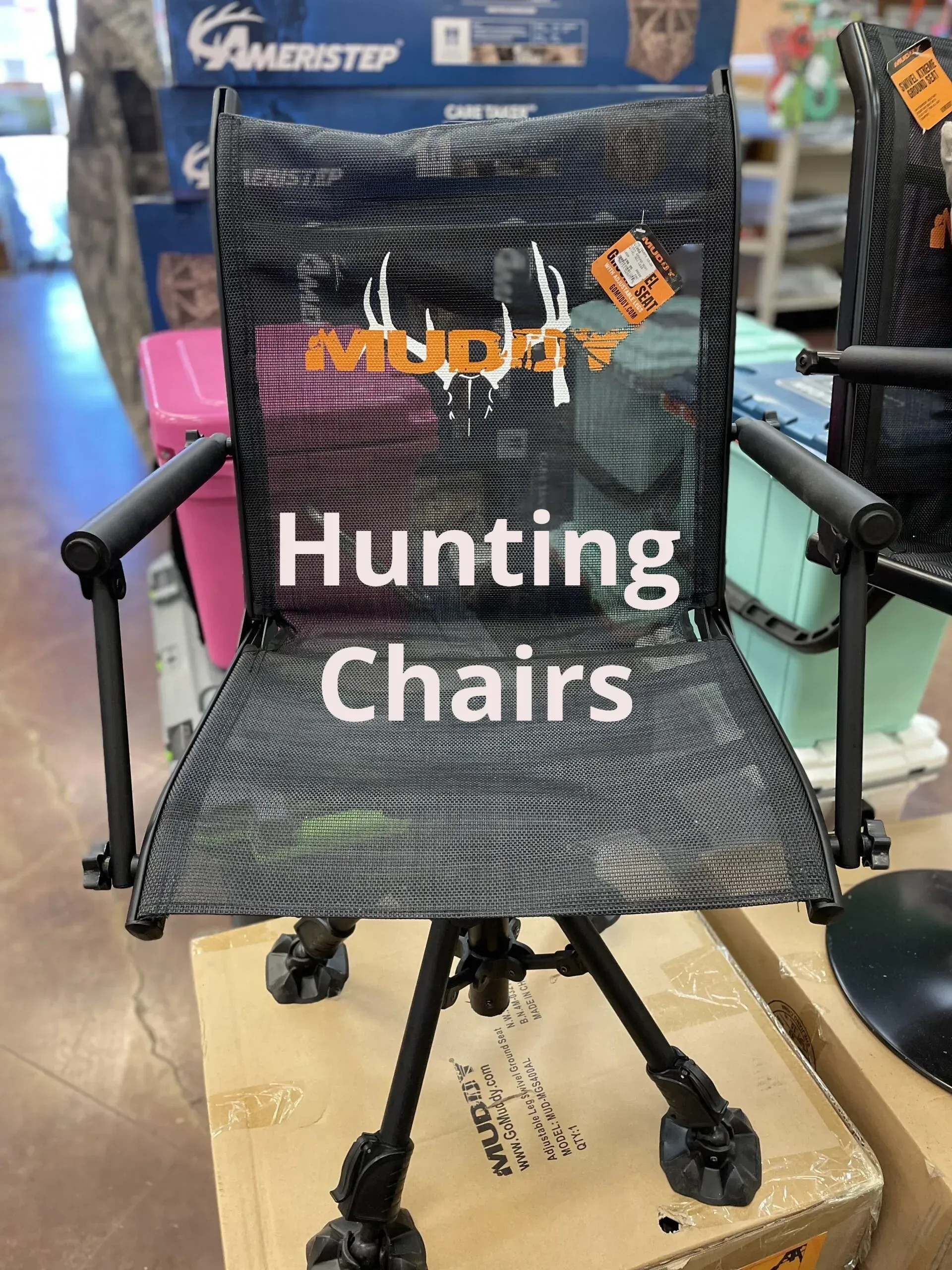A hunting chair is sitting on top of a box in a store.