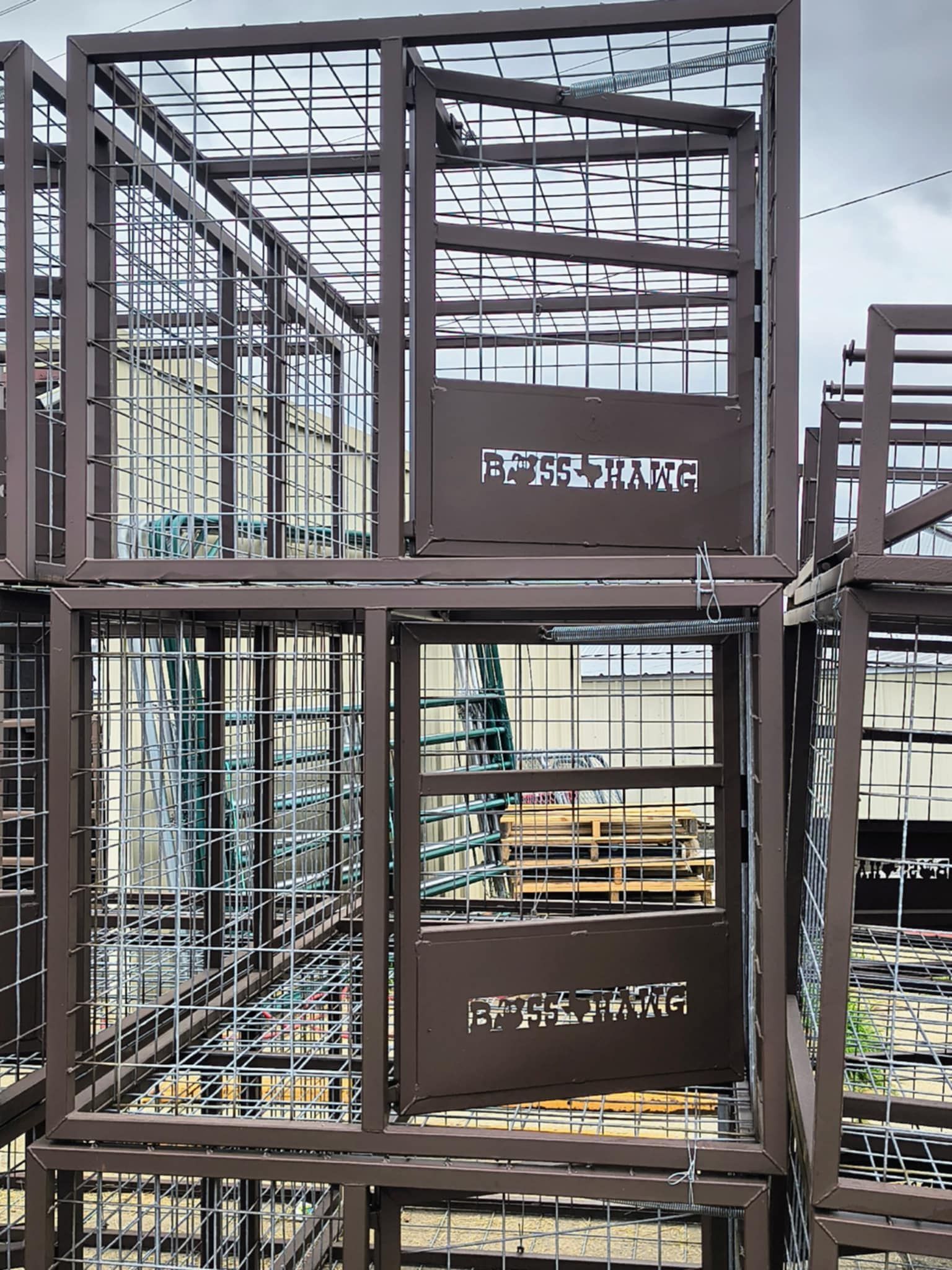 A bunch of metal crates are stacked on top of each other.