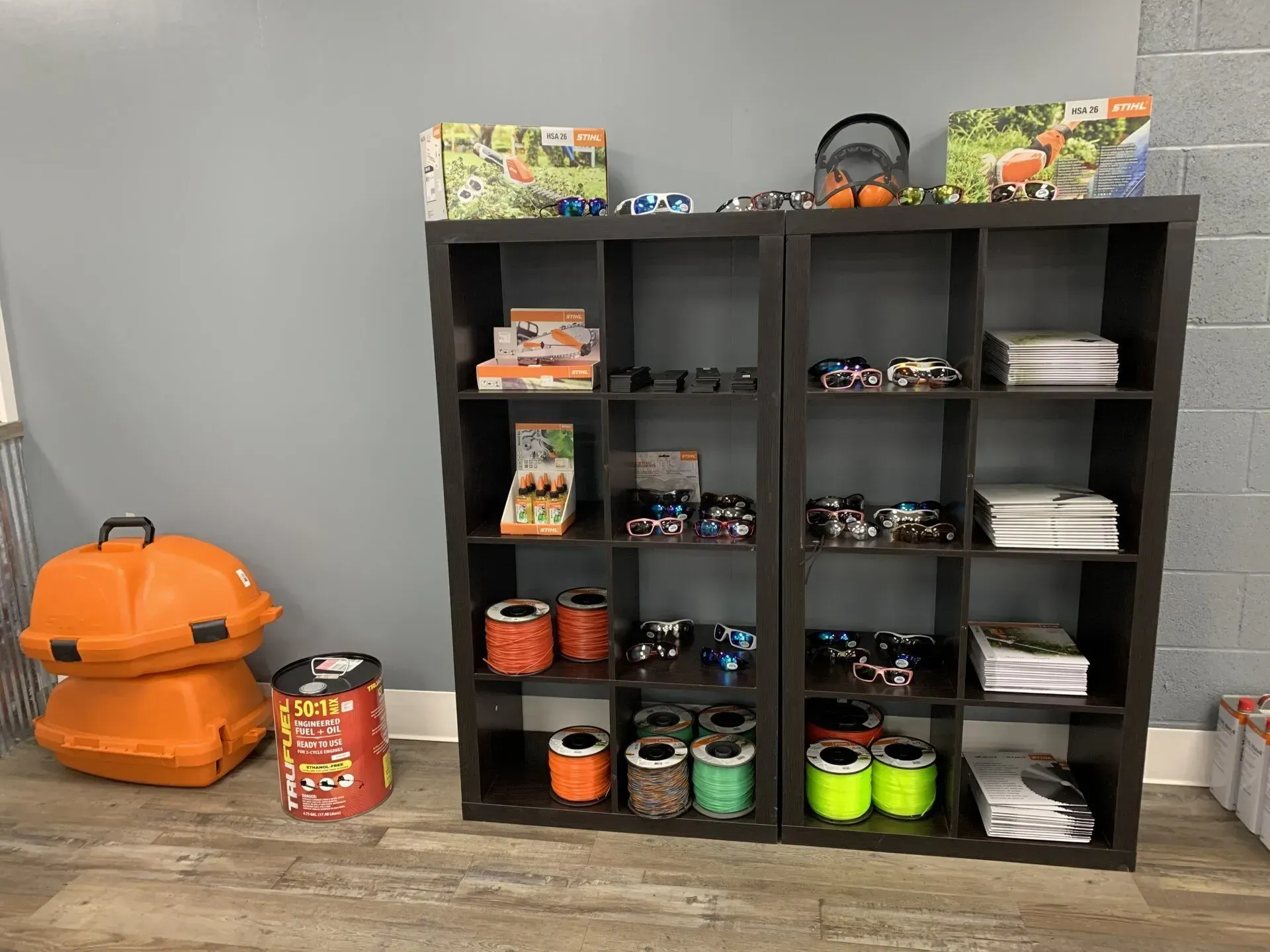 A room with two shelves filled with lots of toys.