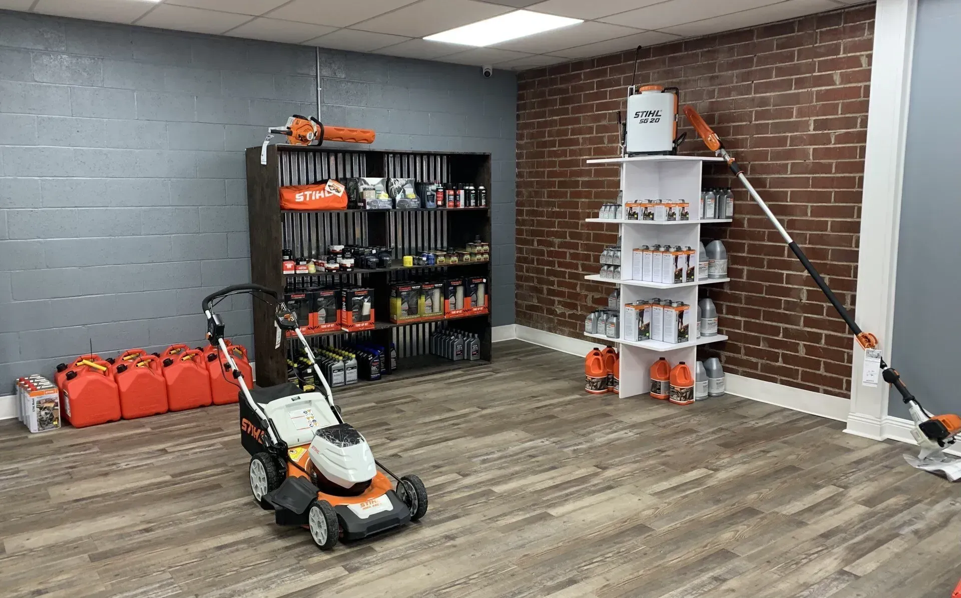 There is a lawn mower in the middle of the room.