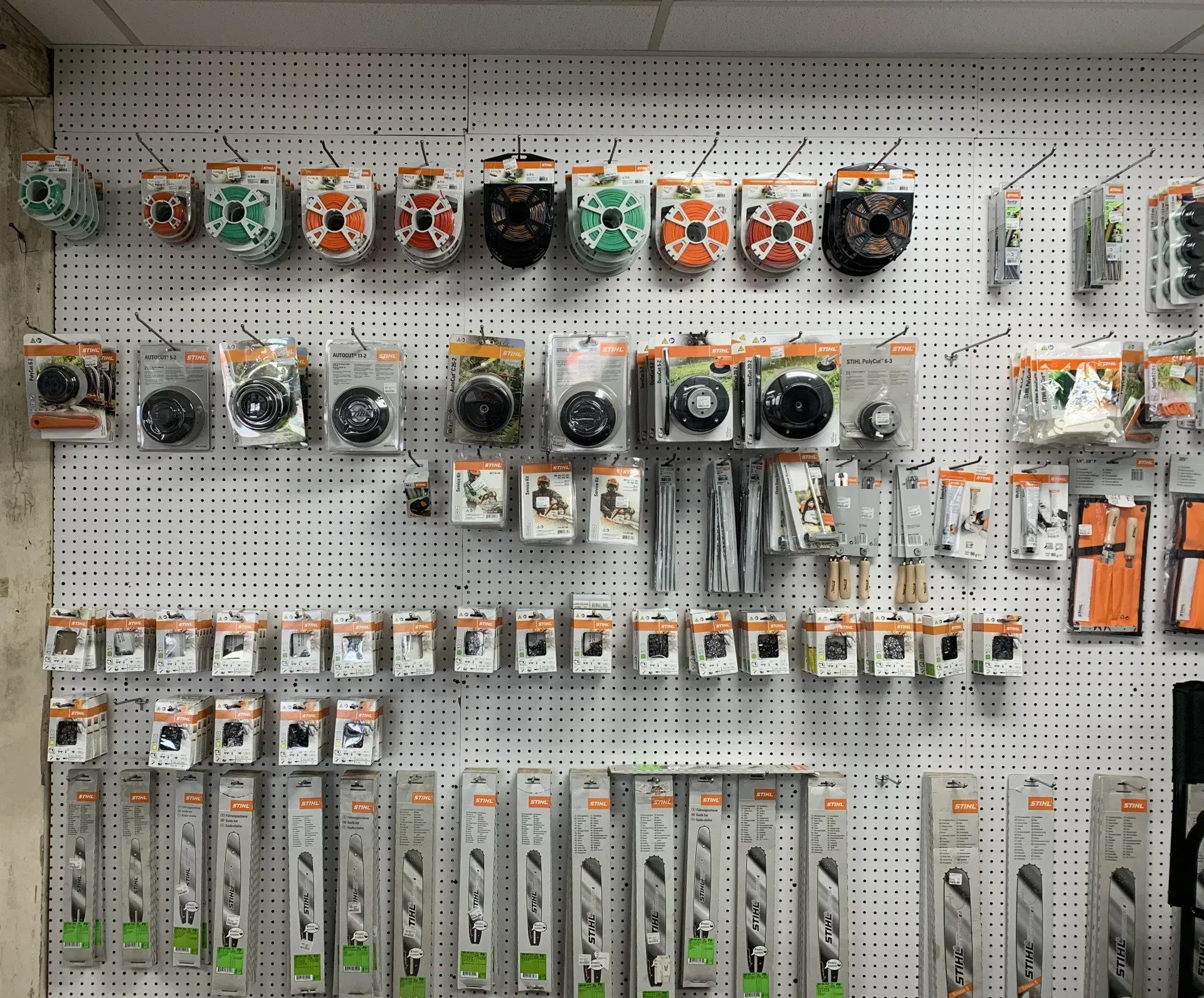 A wall with a bunch of tools hanging on it