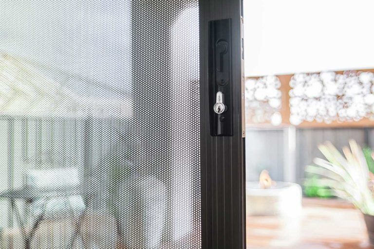 Security Screen With Black Lock — Glass & Aluminium Windows & Doors In Yeppoon, QLD