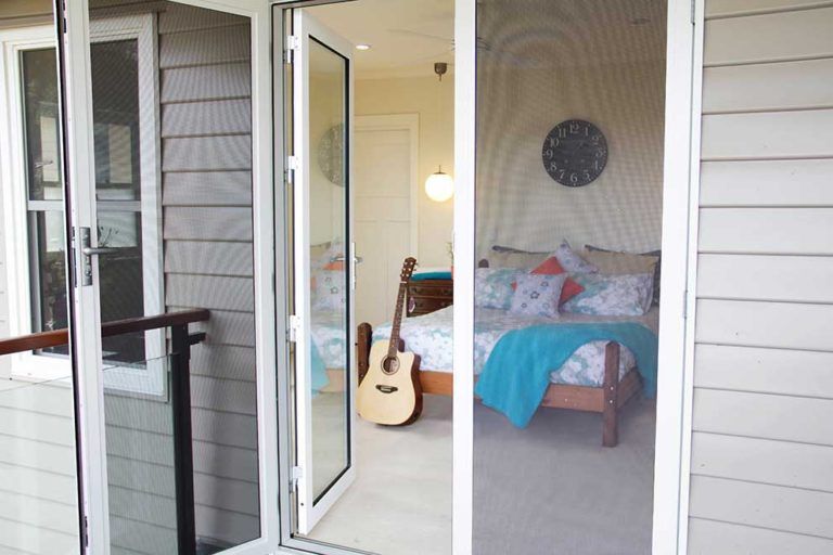 Security Screen Door in Bedroom — Glass & Aluminium Windows & Doors In Yeppoon, QLD