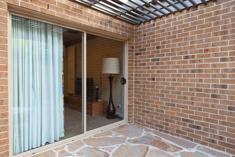 Security Screen Door Leading Outdoors — Glass & Aluminium Windows & Doors In Yeppoon, QLD