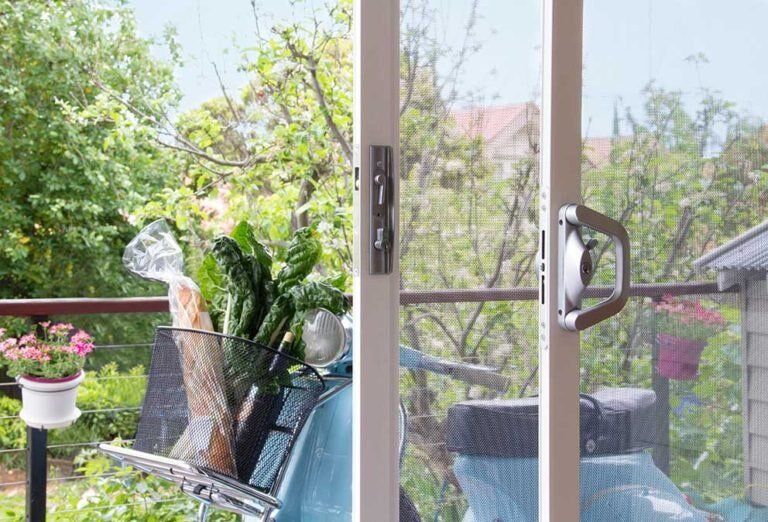 Security Screen Door in Balcony — Glass & Aluminium Windows & Doors In Yeppoon, QLD