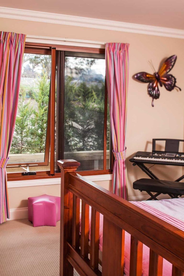 Bedroom With Pink Curtain — Glass & Aluminium Windows & Doors In Yeppoon, QLD