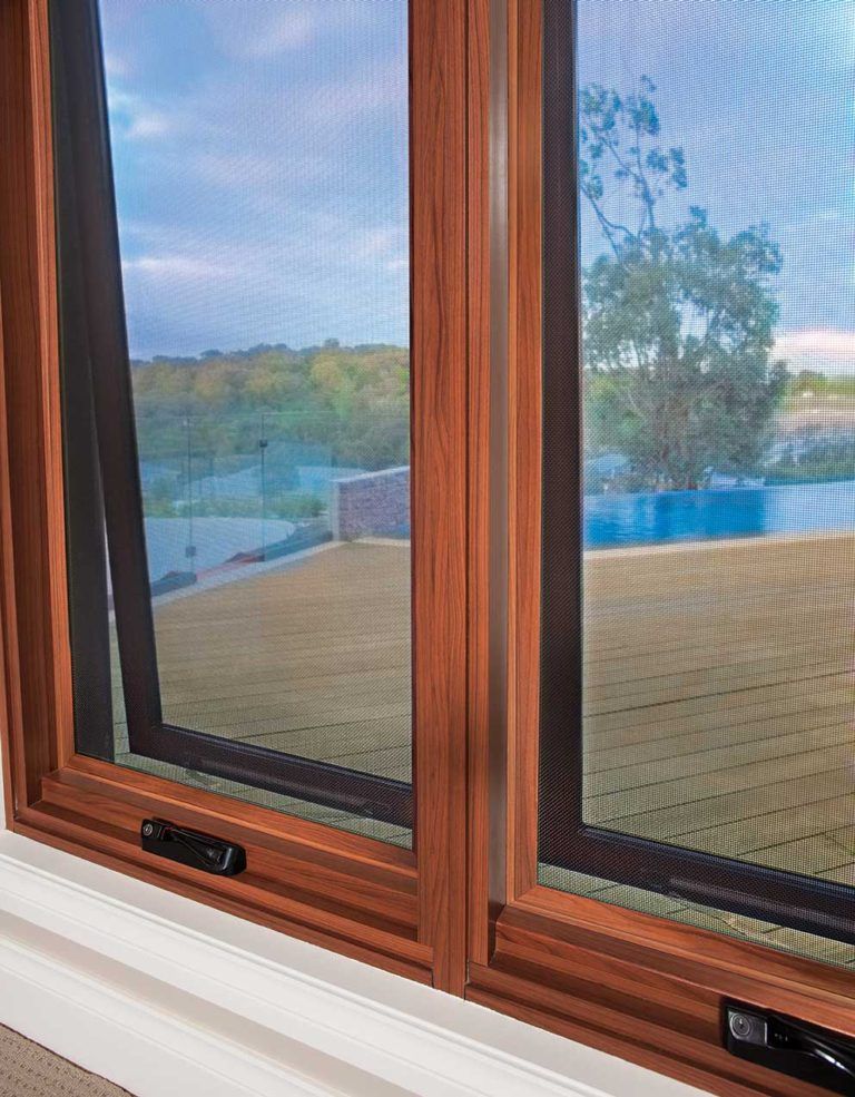 Brown Window With Flyscreen — Glass & Aluminium Windows & Doors In Yeppoon, QLD