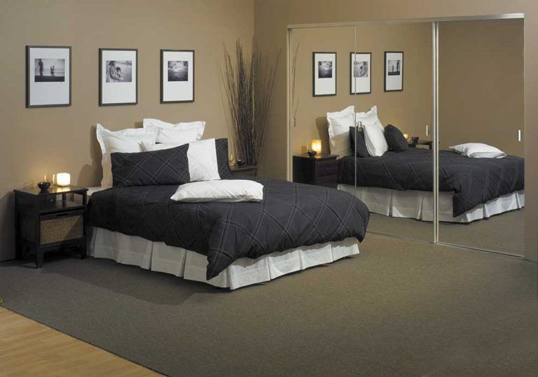 Bedroom With Mirror Wardrobe Doors — Glass & Aluminium Windows & Doors In Yeppoon, QLD