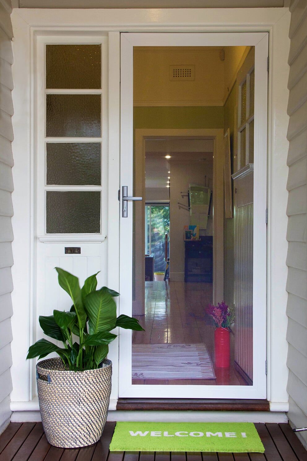 House Door With Plant On Left Side — Glass & Aluminium Windows & Doors In Yeppoon, QLD