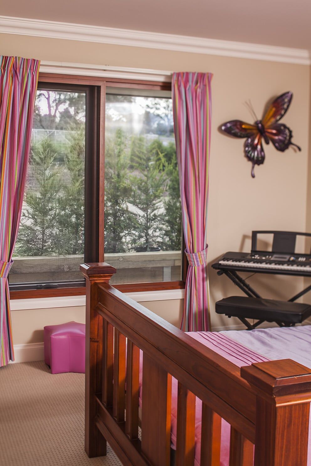 Bedroom With Pink Curtain — Glass & Aluminium Windows & Doors In Yeppoon, QLD