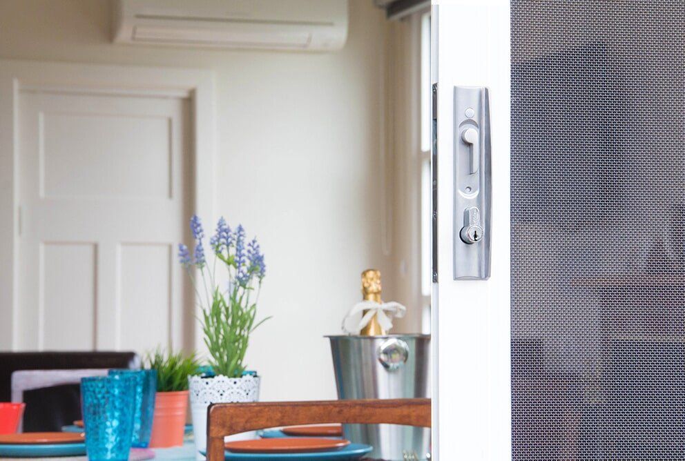 Inside The House With Plant On The Table — Glass & Aluminium Windows & Doors In Yeppoon, QLD