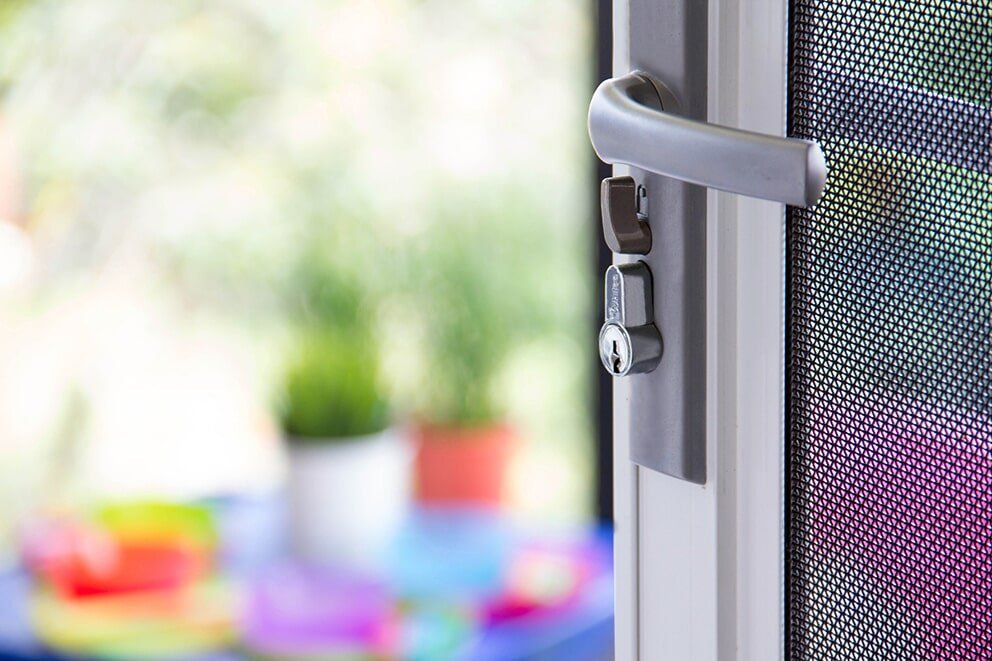 Security Door With Black Handle — Glass & Aluminium Windows & Doors In Yeppoon, QLD