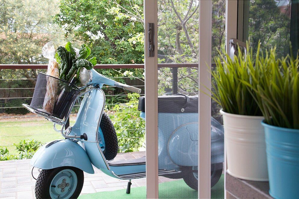 Open Sliding Door With Motorbike — Glass & Aluminium Windows & Doors In Yeppoon, QLD