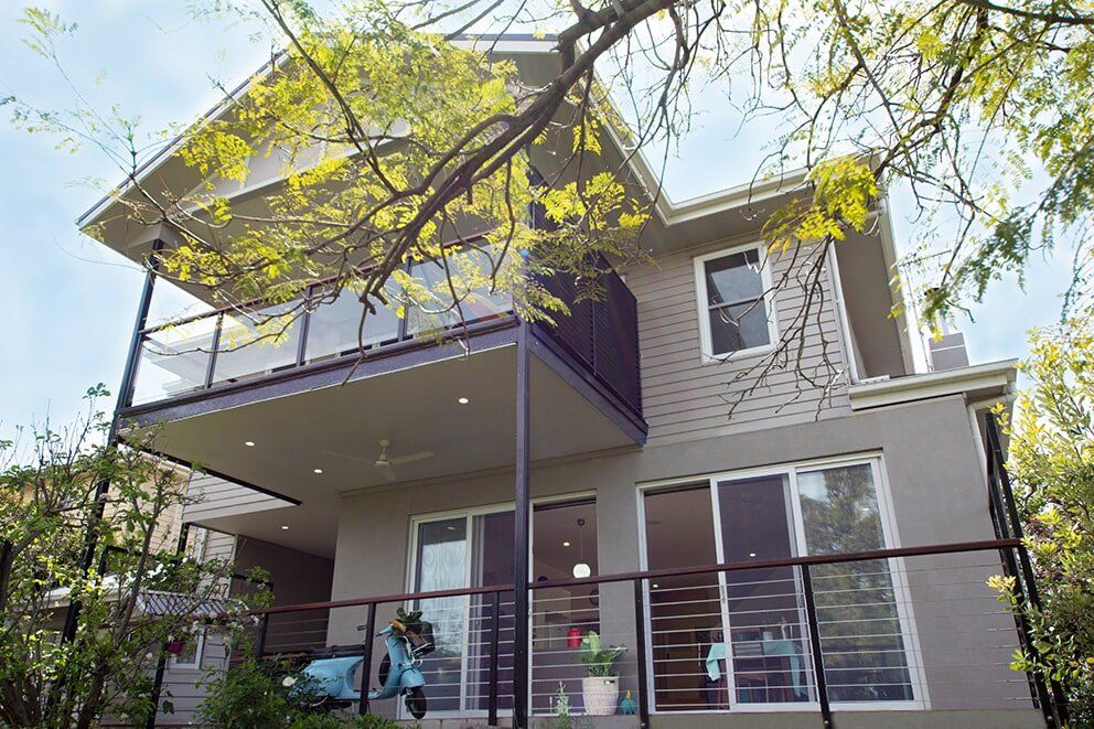 Grey Two-Story Home — Glass & Aluminium Windows & Doors In Yeppoon, QLD