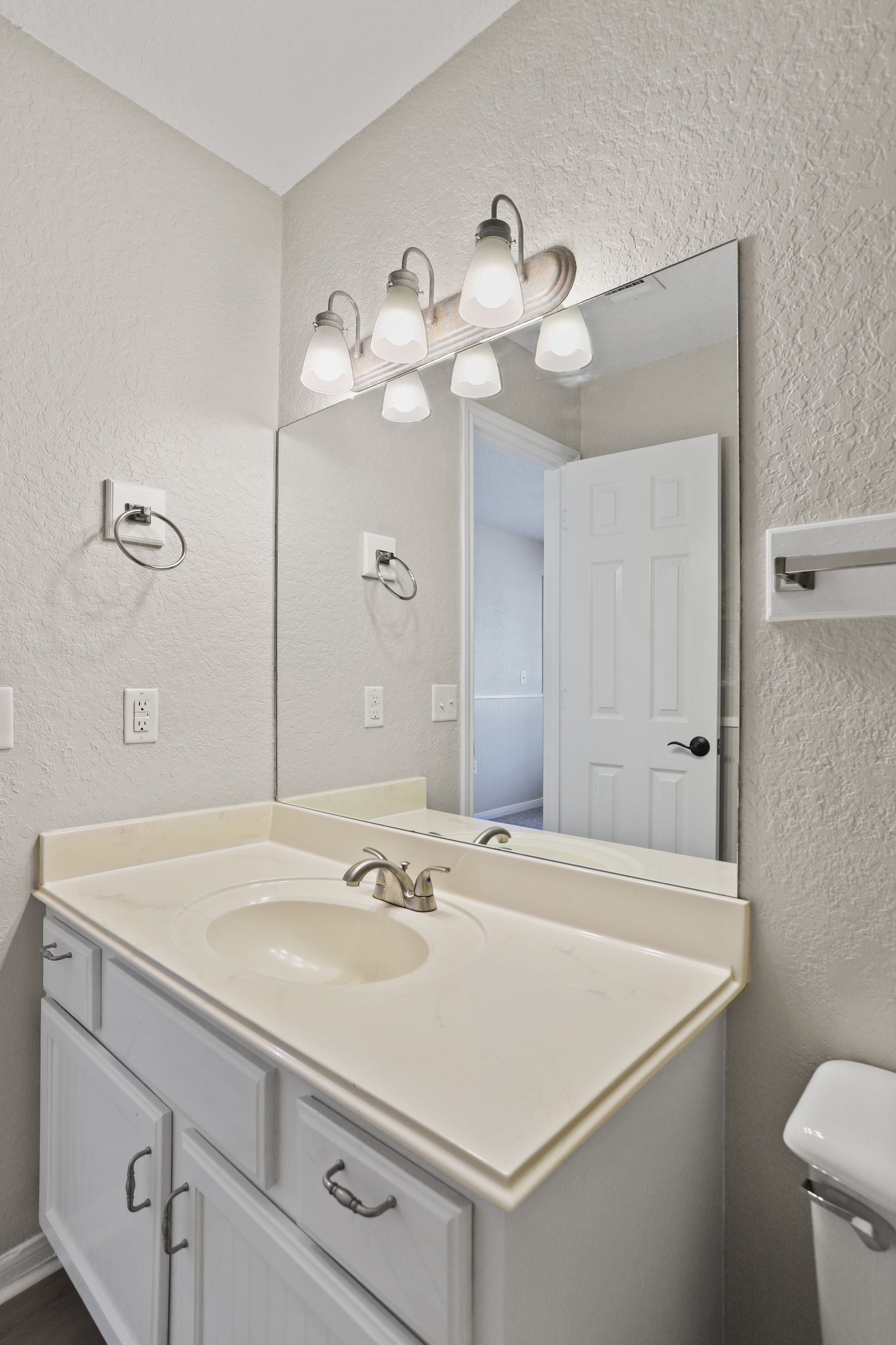 Photo of a wide bathroom sink counter