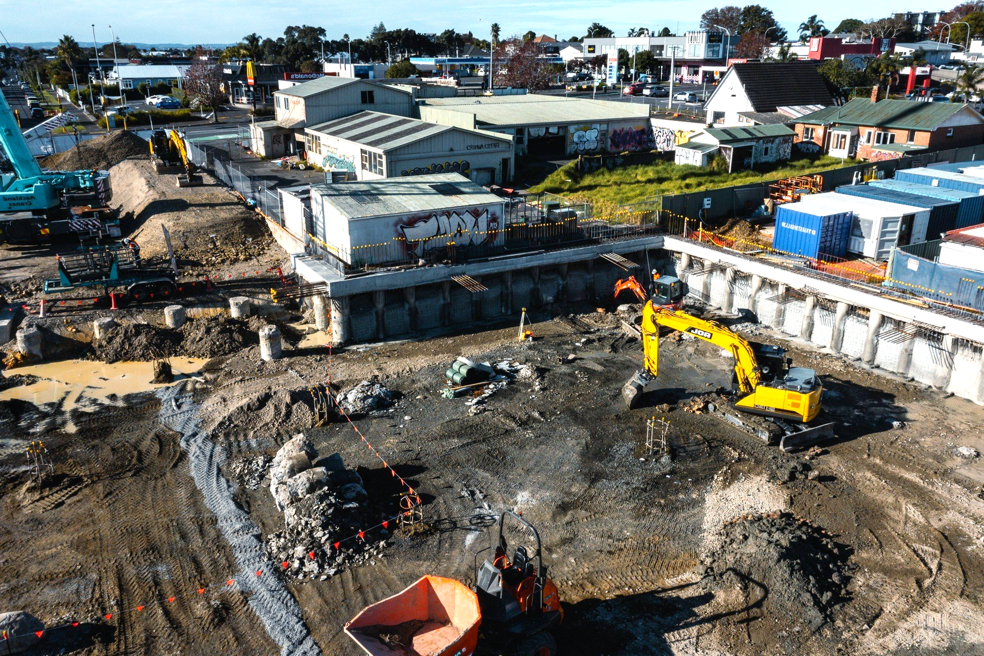 An aerial view of a construction site with a lot of machinery.