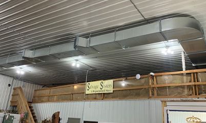 There is a sign on the ceiling of a building that says `` sweet scents ''.
