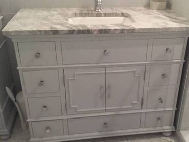 white bathroom vanity with marble countertop