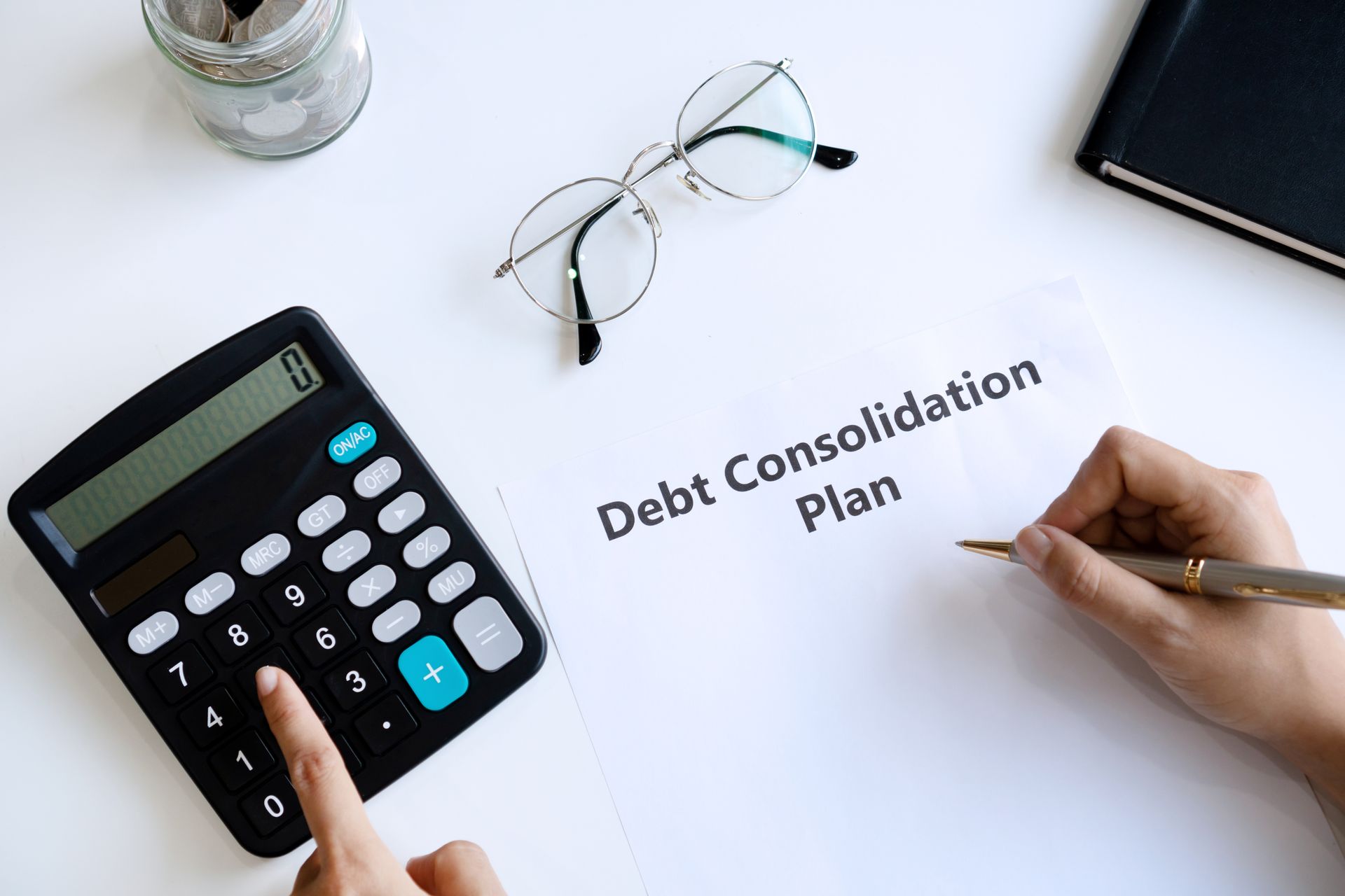 Creating a debt consolidation plan with a calculator.