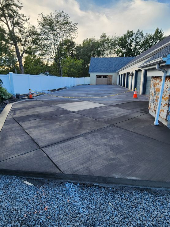 Z&S Construction LLC completed a dyed black concrete driveway with geometric pattern in Hazleton, Pennsylvania