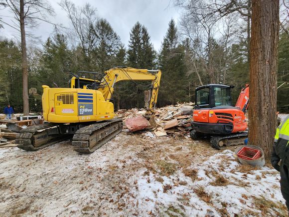 Z&S Construction site in Drums, PA with two excavators clearing debris from a demolished structure during winter