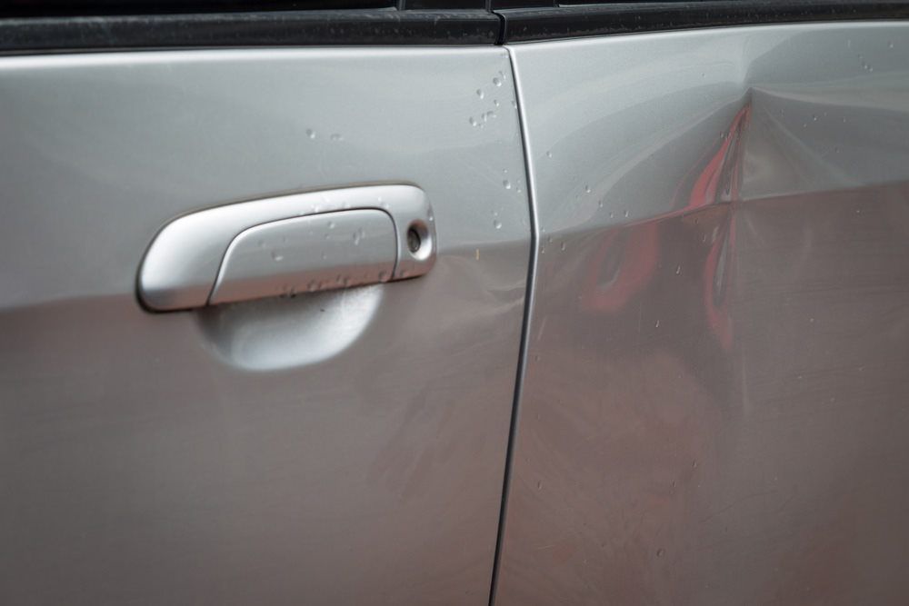 Silver Car With Dent — Panel Beater In Tully, QLD