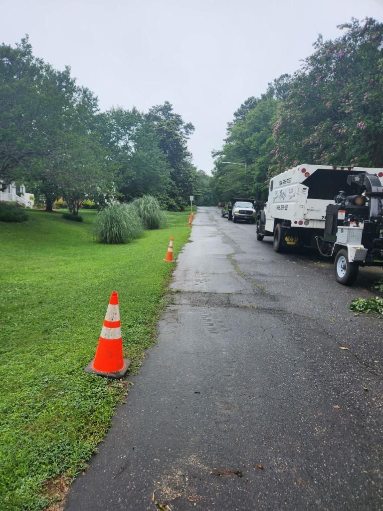 A White Truck Is Parked On The Side Of The Road Next To A Cone — Gastonia, NC — Rocky's Tree Service