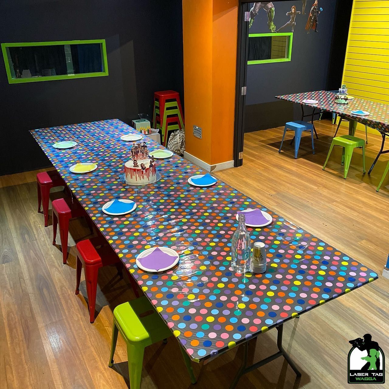 A Long Table With Plates And A Cake On It In Laser Tag— Laser Tag Wagga In Wagga Wagga, NSW
