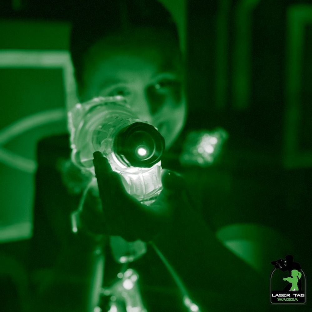 Girl Aiming While Playing Laser Tag — Laser Tag Wagga In Wagga Wagga, NSW