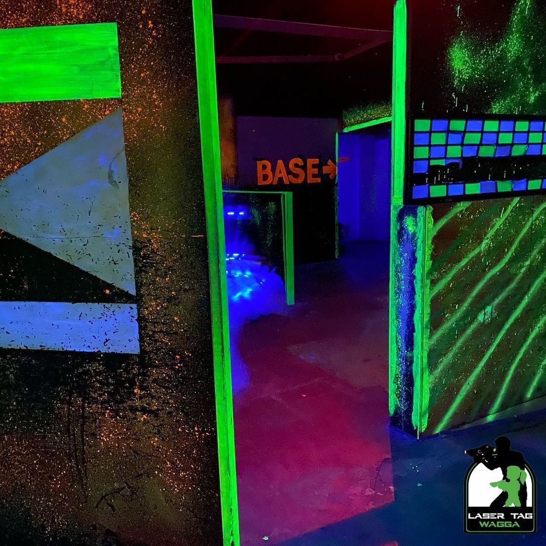 A Room With Glow In The Dark Lights And A Sign That Says Base For A Game Of Laser Tag — Laser Tag Wagga In Wagga Wagga, NSW