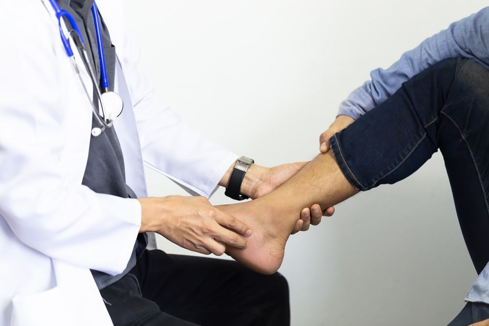 Chiropractor Checking Patient with Fasciitis