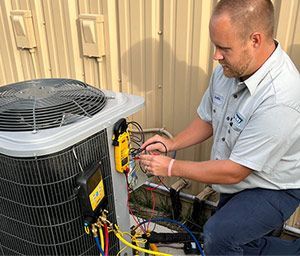 HVAC tech performing AC repair in Port St. Lucie, FL