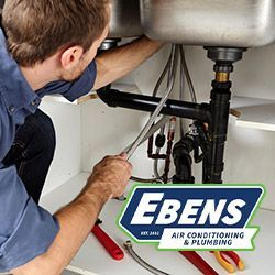 Ebens plumber working on a kitchen sink