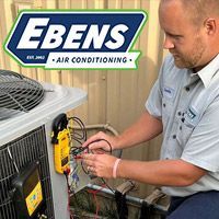 Ebens AC technician repairing an air conditioning system in Port St. Lucie, FL