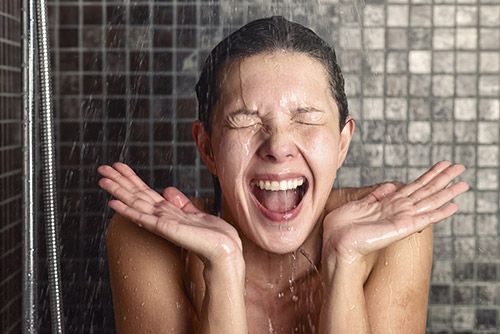 Woman shocked by the cold temperature of water in her shower