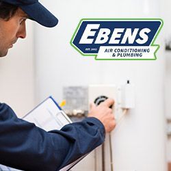 Ebens plumber checking a water heater