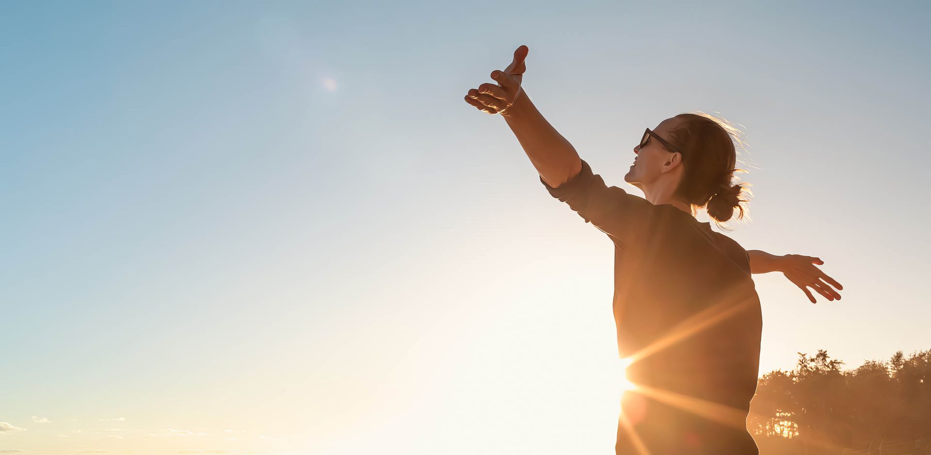 A woman is holding her head in pain.