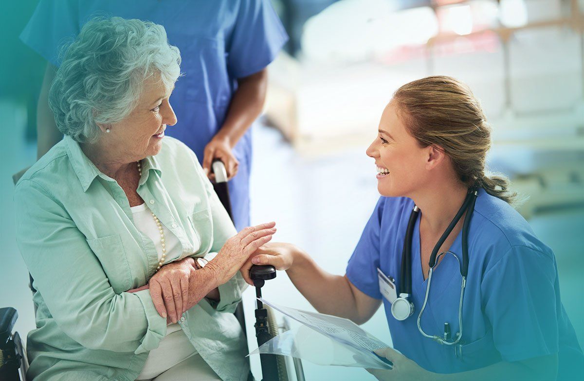 Nurse smiling at patient