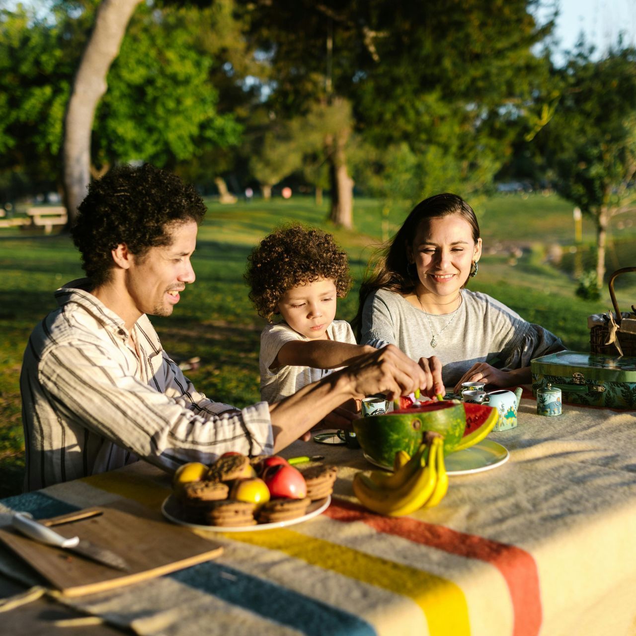A family is having a picnic in the park.