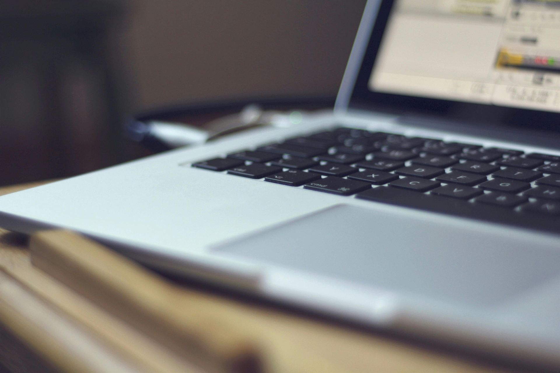 A close up of a Virtual Assistant's laptop on a table.