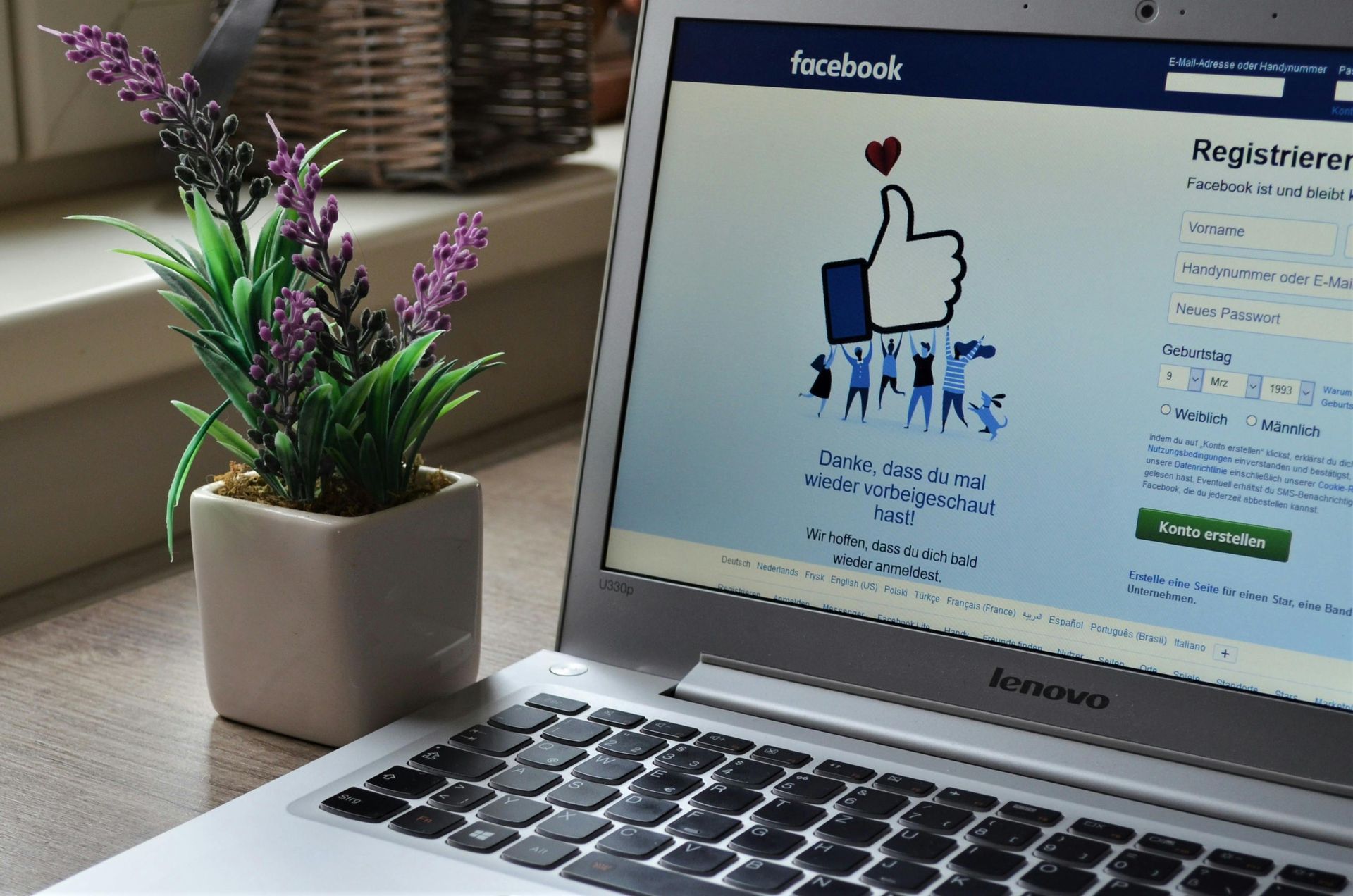 A laptop computer is open to a facebook page.