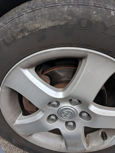 A close up of a car wheel with a tire on it.