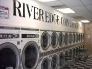 Row of washing machines at River Edge Coin Laundry.